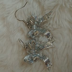 Sparkly silver tone bow earrings